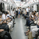 Everyone is on their smartphones in the subway in Japan.